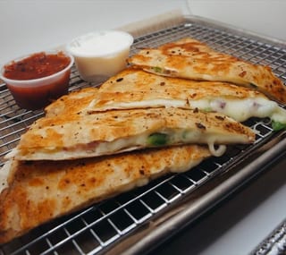 Grilled Quesadilla wedges with salsa and sour cream
