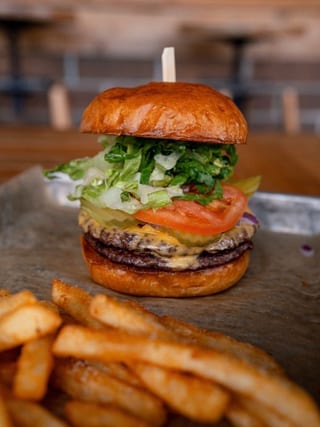 The Classic burger with lettuce, tomato, cheese and fries